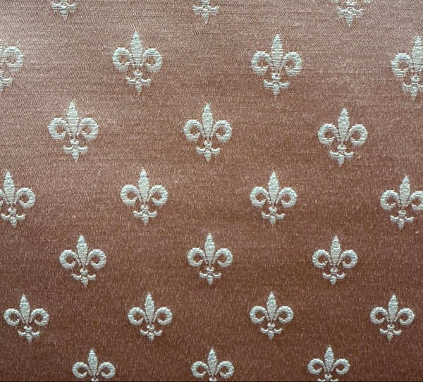 Pattern of fleur-de-lis symbols on a brown background