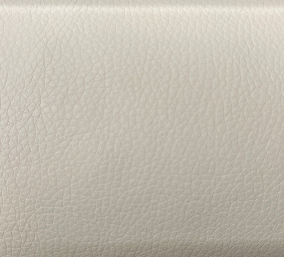 Close-up texture shot of a solid white upholstery pillow fabric.