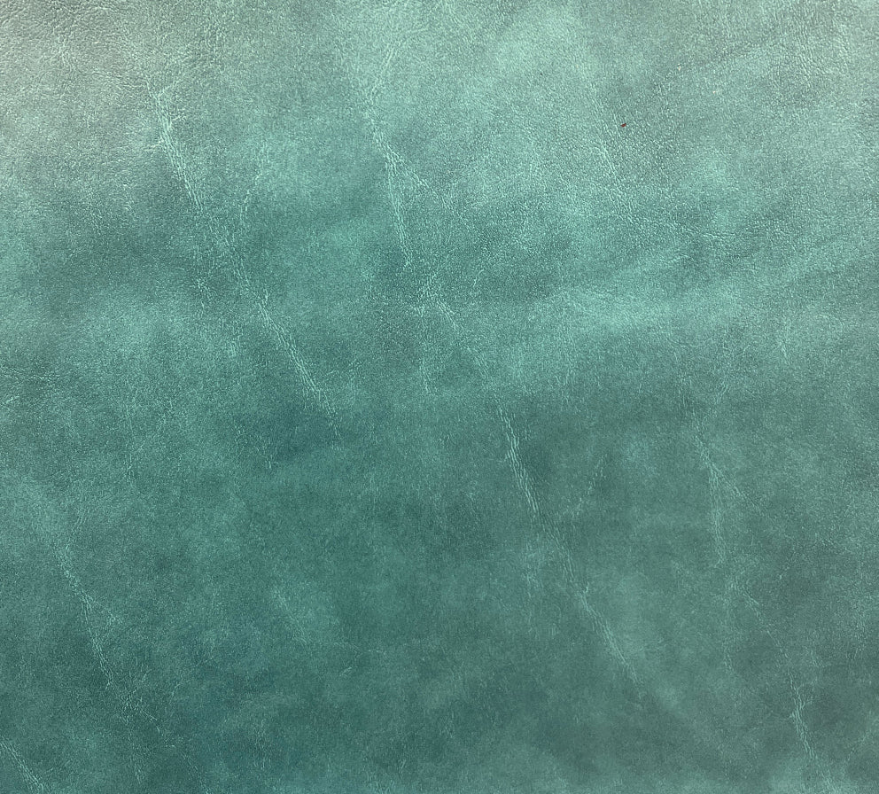 A textured green upholstery fabric