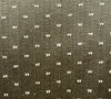 A close-up image of a textured fabric with a dotted pattern.
