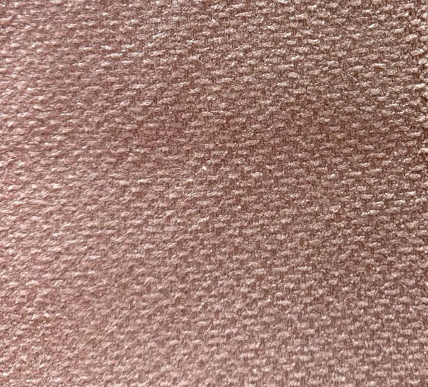 A close-up texture shot of a fabric with a leaf-like pattern.