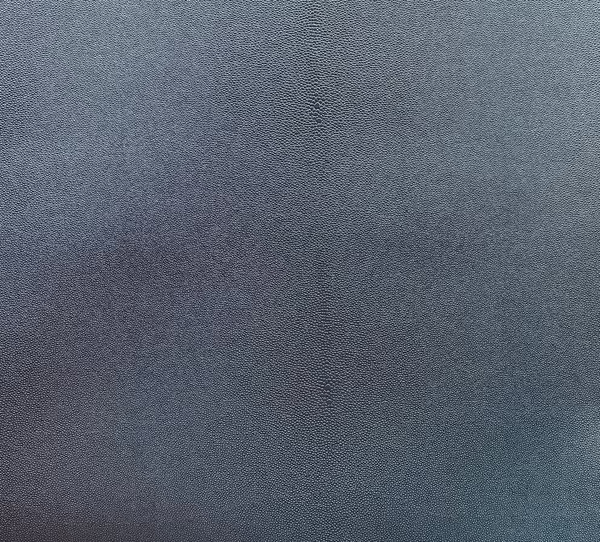 A close-up image of a textured gray polyester fabric.