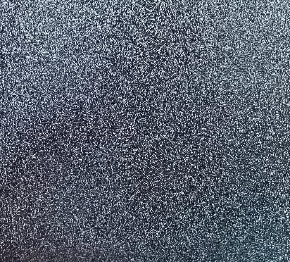 A close-up image of a textured gray polyester fabric.