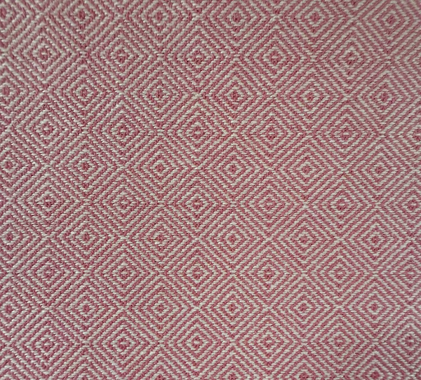 Red and white geometric diamond patterned fabric texture