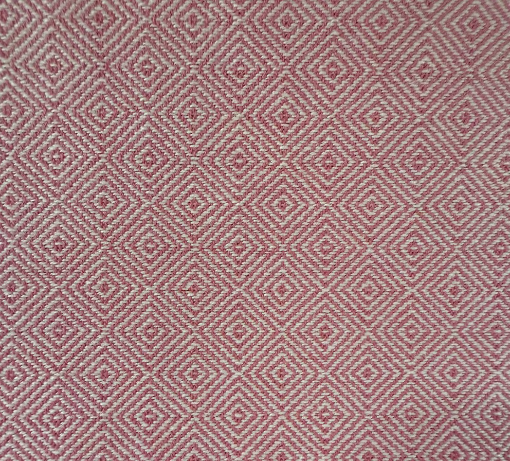 Red and white geometric diamond patterned fabric texture