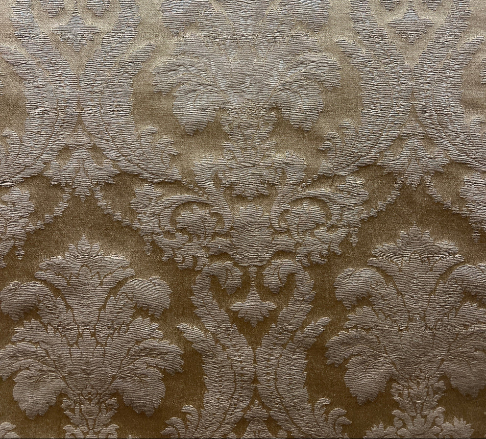 beige fabric with a floral damask pattern.