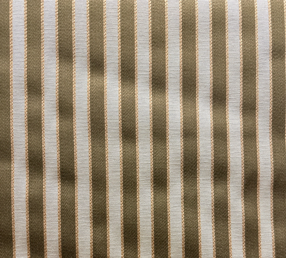 A close-up image of a striped fabric with brown and white colors.
