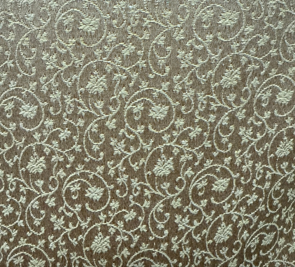 A close-up image of a fabric with a floral pattern in a beige color.