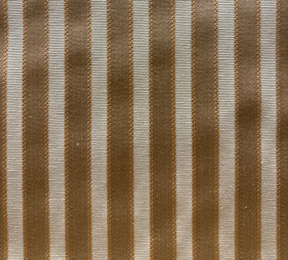 A close-up image of a striped fabric with a pattern of brown and white lines.
