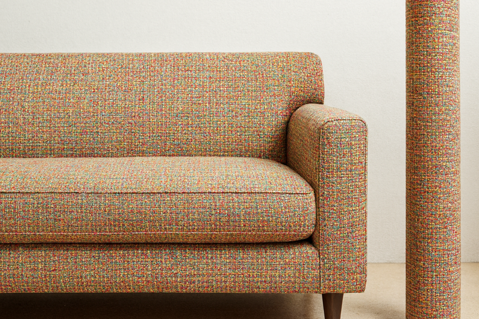 Multicolored textured sofa against a white wall