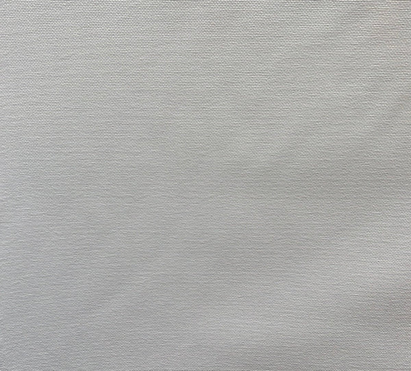 A plain textured white fabric, likely to be a close-up of the upholstery slipcover material.