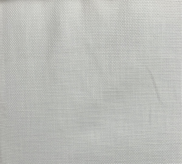 Close-up of a white cotton fabric with a solid pattern and slight texture.