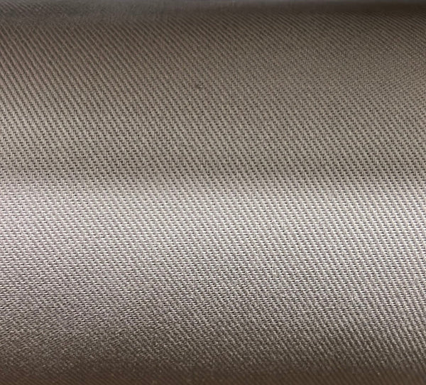 Close-up texture shot of a solid beige cotton fabric.