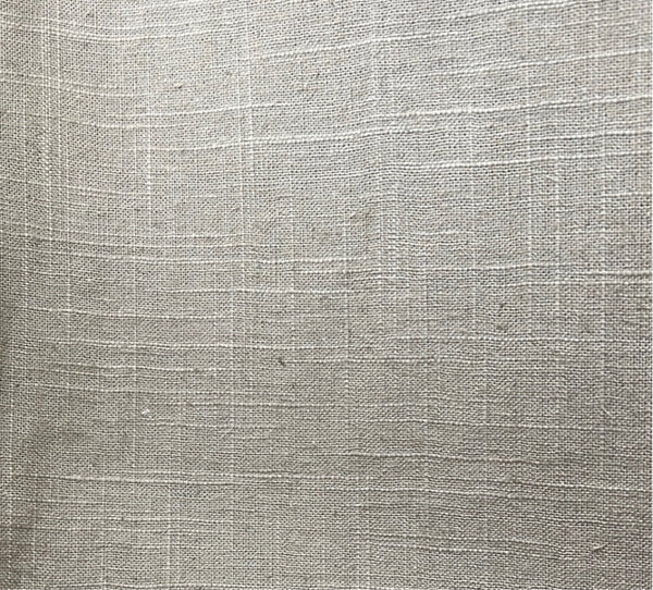 Close-up texture shot of a beige cotton-linen blend fabric.