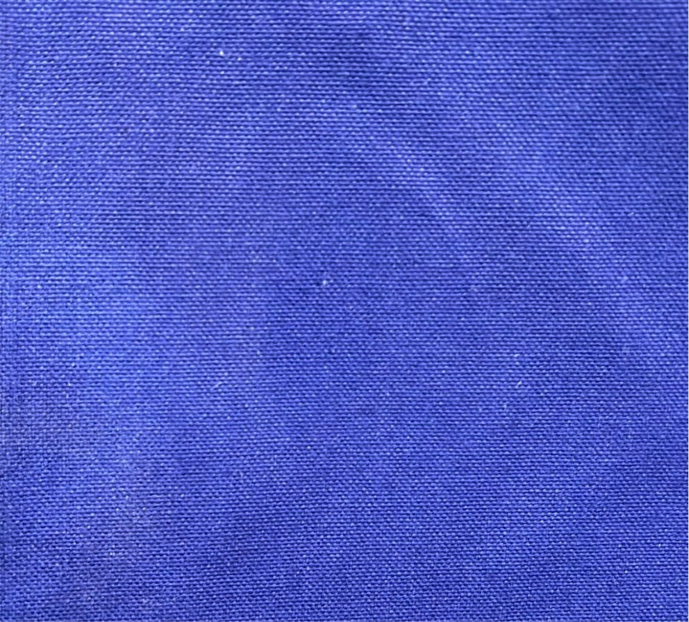 blue textured fabric with a visible thread count.