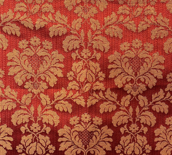 Close-up of a red fabric with a floral pattern
