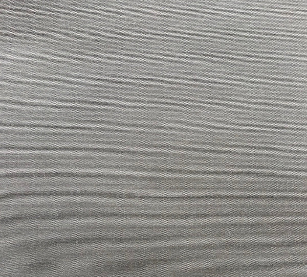 A swatch of light grey, solid pattern fabric, likely a polyester blend, suitable for upholstery and drapery.