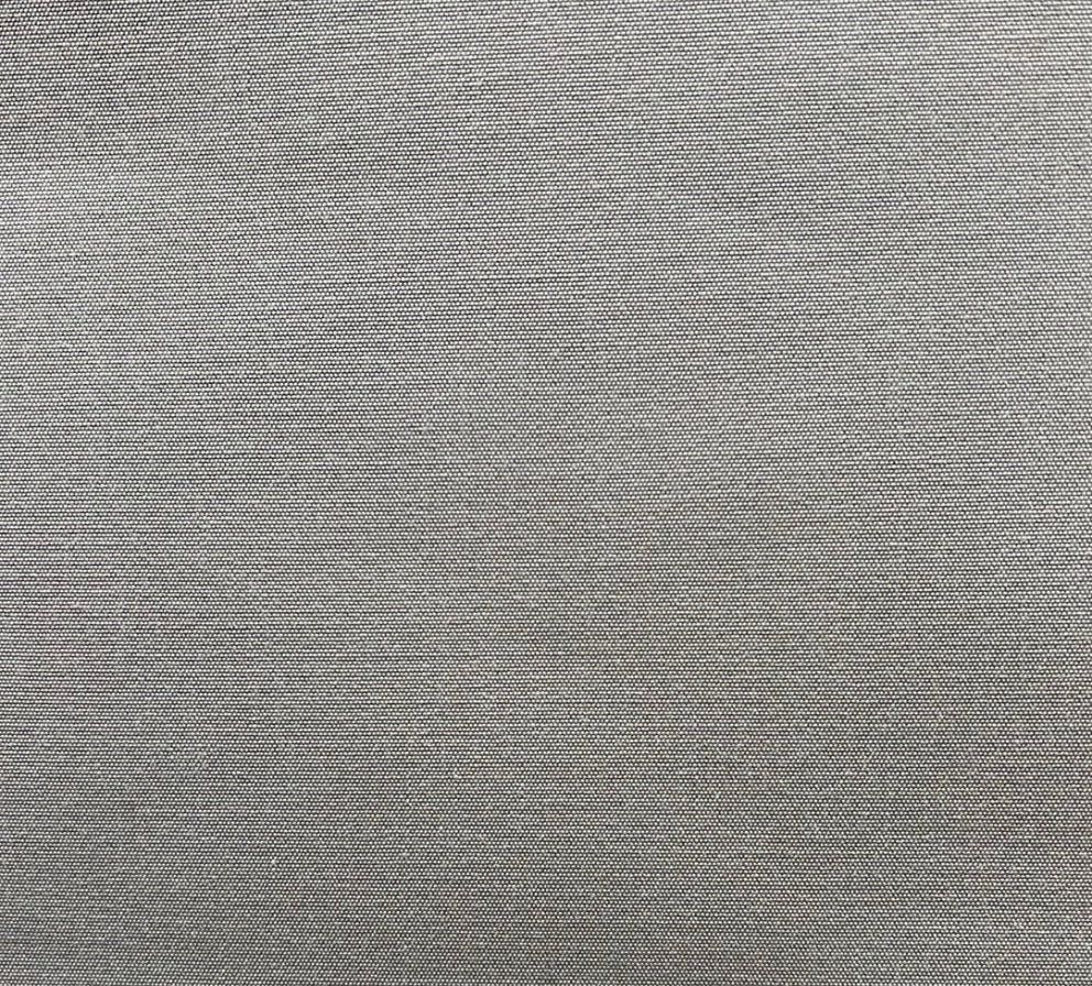 A swatch of light grey, solid pattern fabric, likely a polyester blend, suitable for upholstery and drapery.